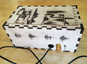 The Sonic Mirror's enclosure features laser engraved images of spectrograms and waveforms of the spoken words "sonic mirror."