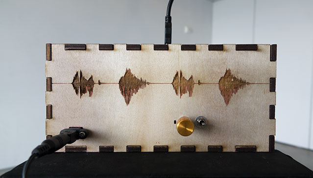 Side profile of wooden laser-engraved enclosure of Sonic Mirror v2 hardware instrument.