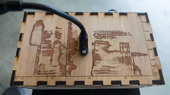Side profile of wooden laser-engraved enclosure of Sonic Mirror v2 hardware instrument.