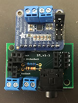Custom designed PCB used in Sonic Mirror v2.0 populated with 3.5mm audio jack, screw terminals, 3.7 W Class-D speaker amp, and other electronics